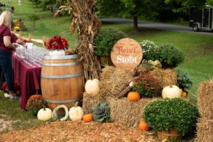 Tableau of autumn decorations and Twist & Stout signage